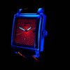 Montre homme suisse personnalisable GRECO-Genève, aérographe rouge fluorescent, cadran anthracite plaqué ruthénium, boîtier circulaire satiné, acier inoxydable poli, vue de côté sous lumière ultraviolette